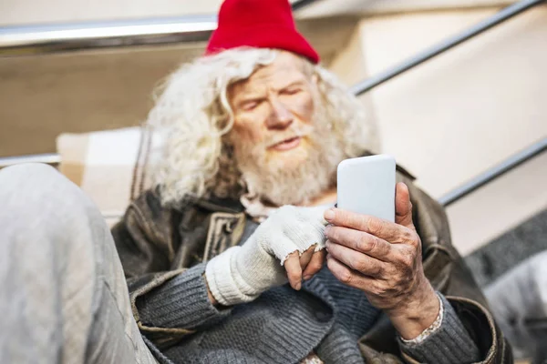 Nice bearded man pressing a smartphone screen — Stock Photo, Image