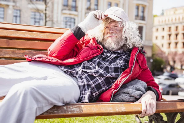 Nice aged man holding his cap — Stock Photo, Image