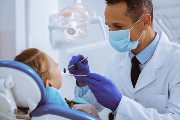 Competent assistant working in modern clinic