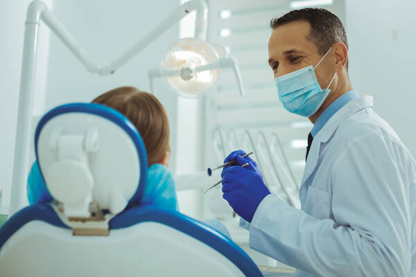 Positive delighted practitioner treating his visitor