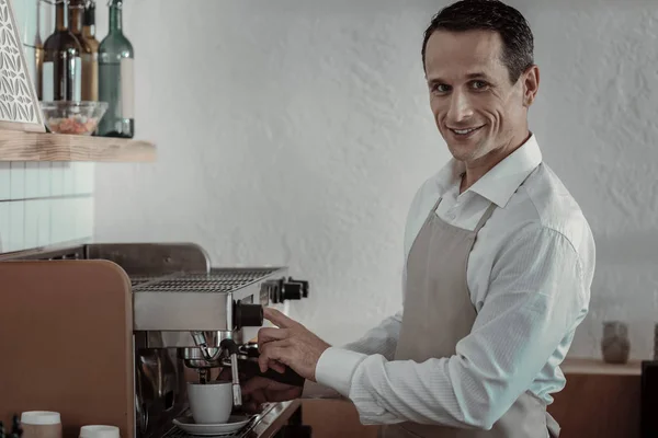 Attractive brunette male preparing coffee — Stock Photo, Image