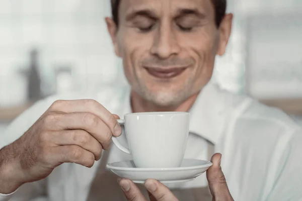 Close up of handsome man that smelling drink — Stock Photo, Image