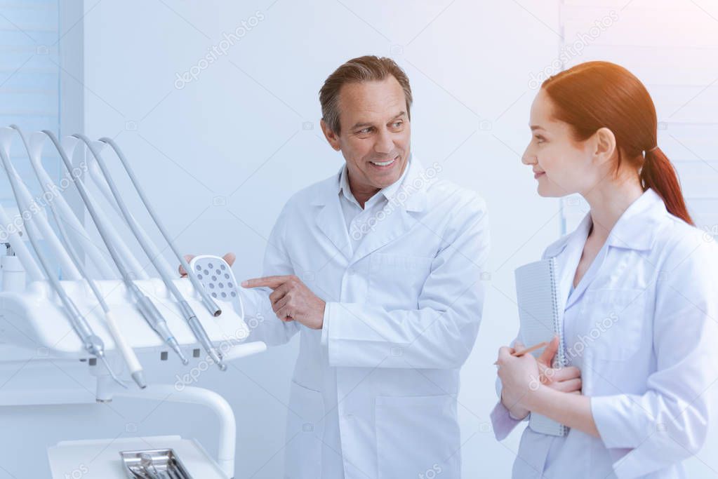 Portrait of colleagues while doing checkup for instruments