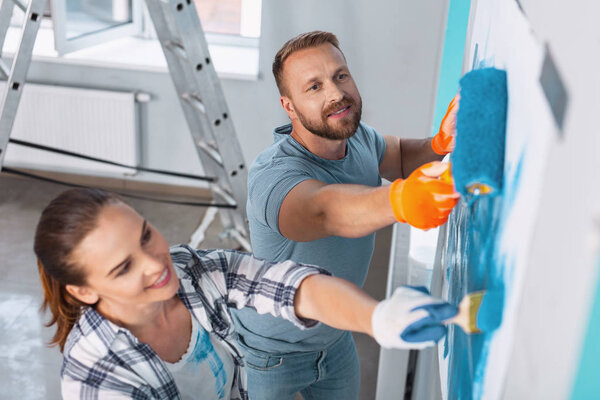 Content painters doing renovations in the apartment