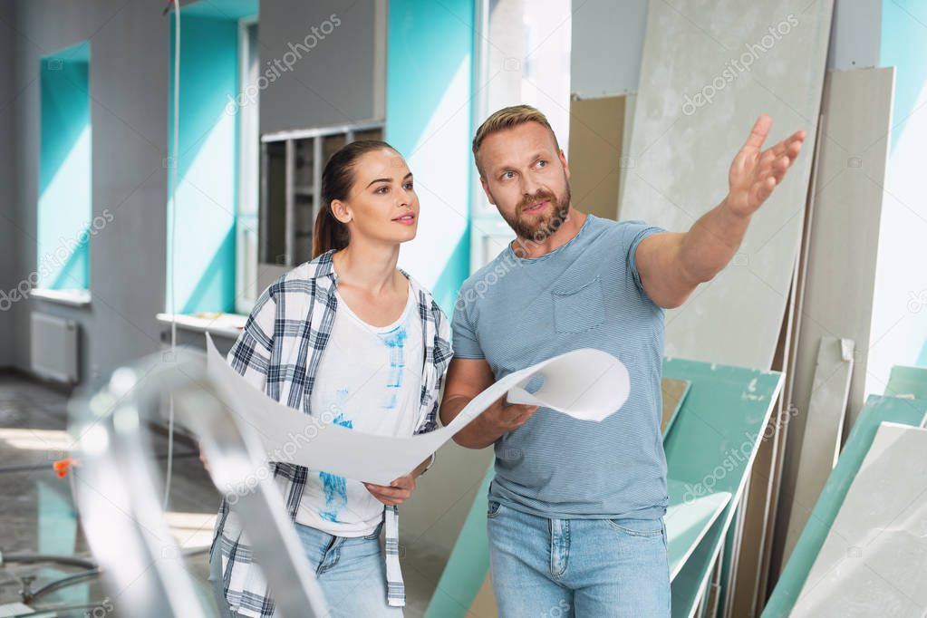 Serious man telling his preferences in renovations