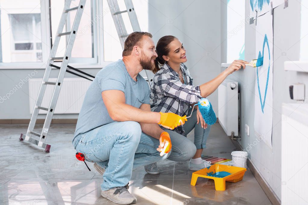 Loving couple doing renovations together