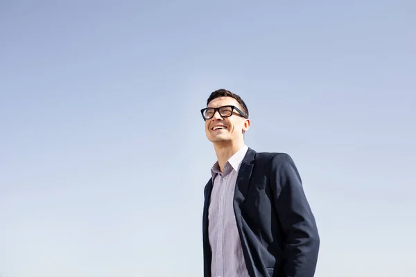 Beaming elegant businessman looking into the sky — Stock Photo, Image