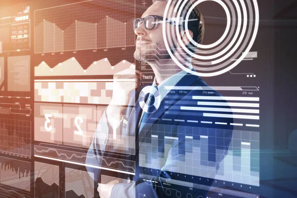 Elegant man wearing glasses and smiling while looking at the screen — Stock Photo, Image