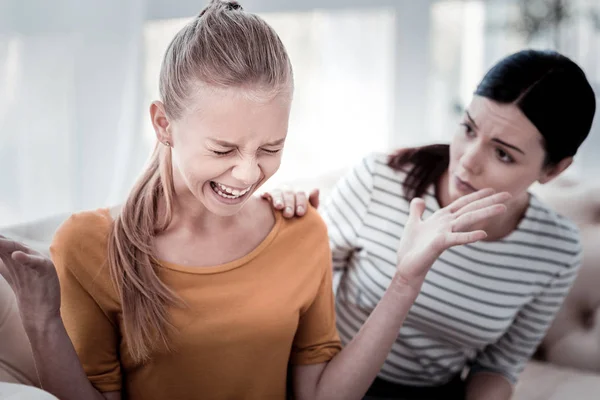 Close up of crying girl during a visit to psychologist — Stock Photo, Image