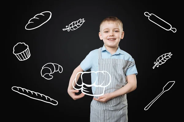 Cute boy smiling a dreaming about becoming a cook — Stock Image Cute boy smiling a dreaming about becoming a cook Stock Image