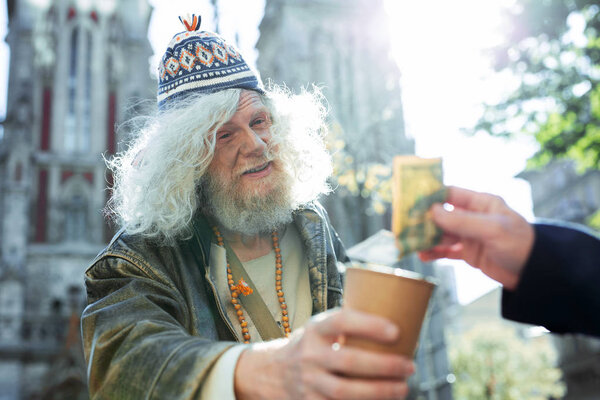 Poor man suffering from hunger feeling relieved