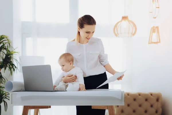 Attentive female person looking at paper — Stock Photo, Image