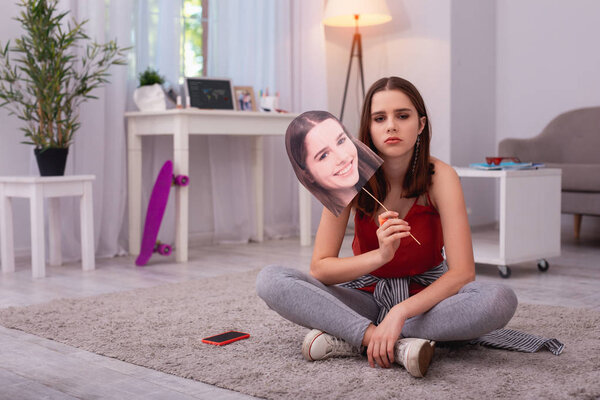 Depressed teen girl facing misunderstanding