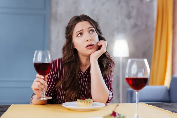 Depressed businesswoman talking to her friend during dinner — Stock Photo, Image