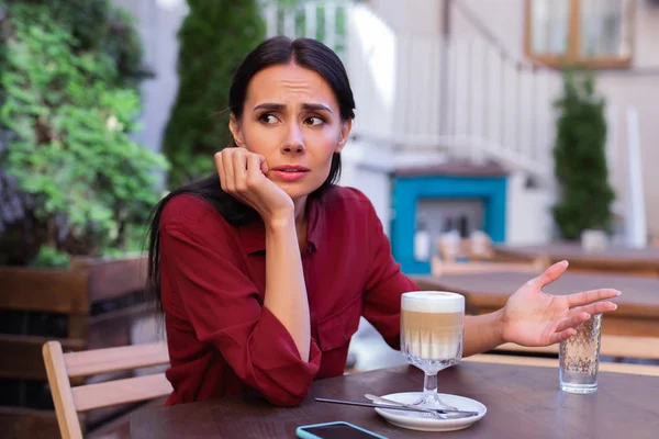 Businesswoman feeling emotional while having dispute with partner — Stock Photo, Image