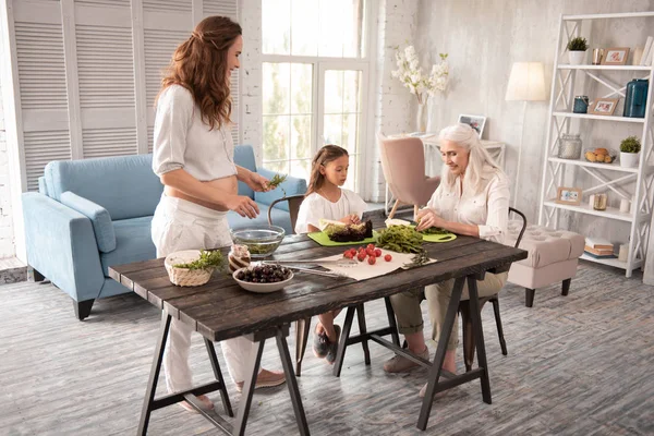 Happy family cooking healthy dinner together