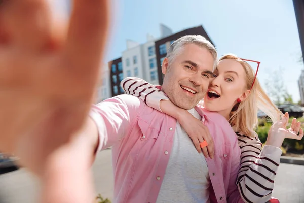 Delighted positive couple taking selfies — Stock Photo, Image