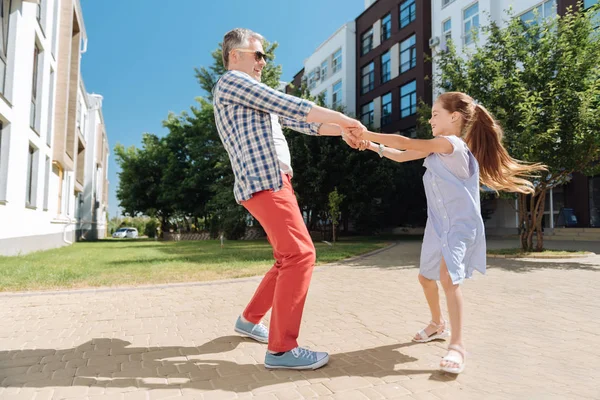 Delighted nice father and daughter playing together — Stock Photo, Image