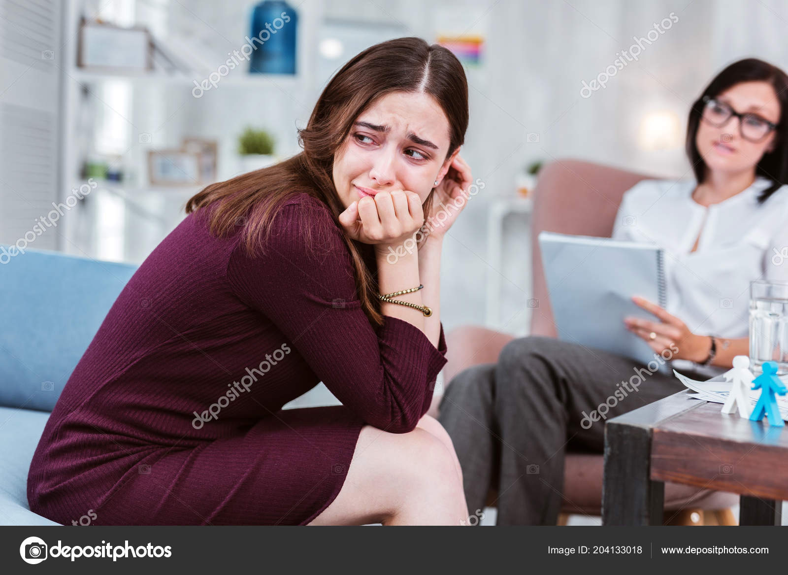 Sad Woman Crying While Visiting Her Psychologist Stock Photo