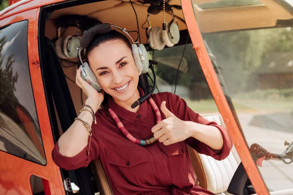 Cheerful gay woman gaining experience — Stock Photo, Image