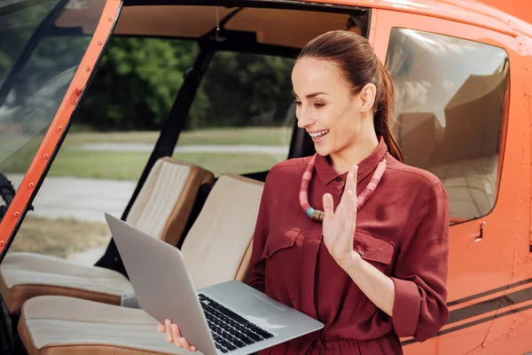 Exuberant nice woman calling online — Stock Photo, Image