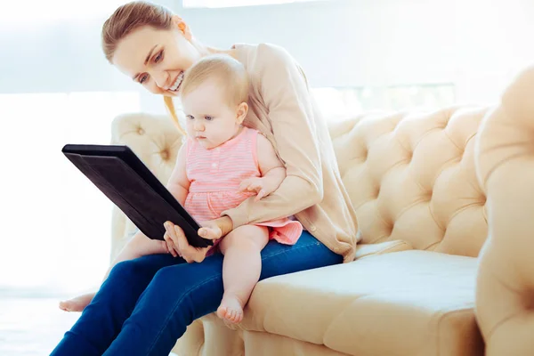 Attentive girl looking at gadget — Stock Photo, Image