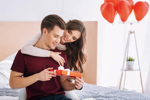 Charming woman embracing her boyfriend — Stock Photo, Image