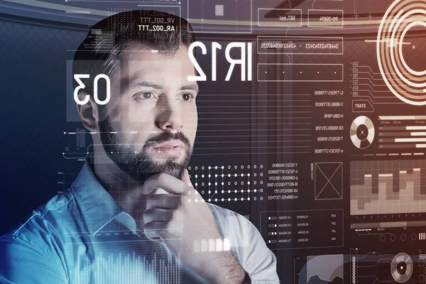 Smart programmer looking interested while checking his program — Stock Photo, Image