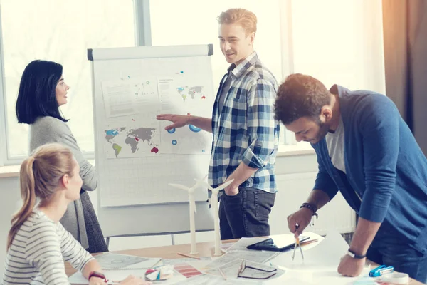 Attentive engineer drawing little circle — Stock Photo, Image