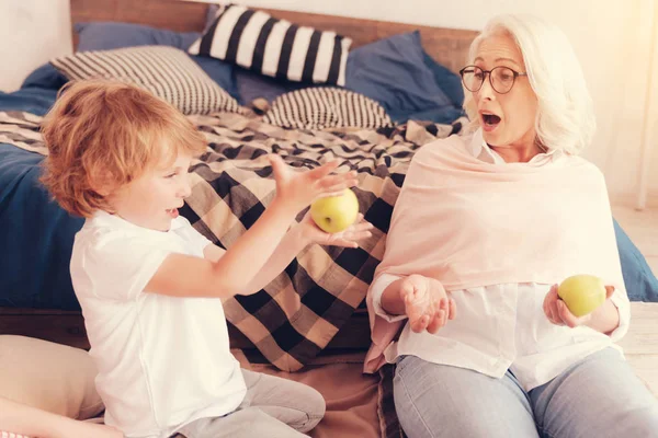 Emotional granny getting surprised after watching her grandson talent — Stock Photo, Image