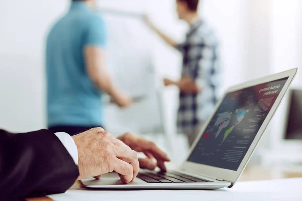 Attentive worker making a presentation on a laptop — Stock Photo, Image