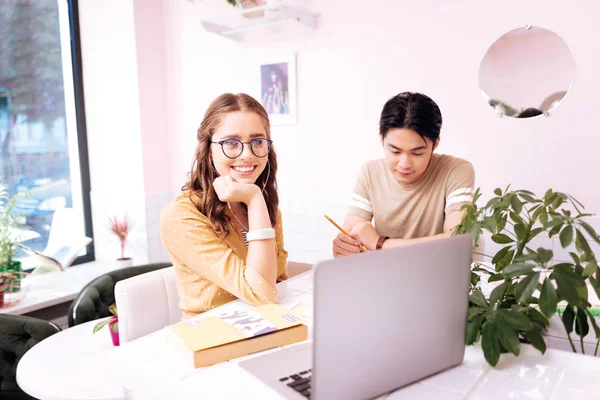 Beautiful student listening t music in earphones during break — Stock Photo, Image