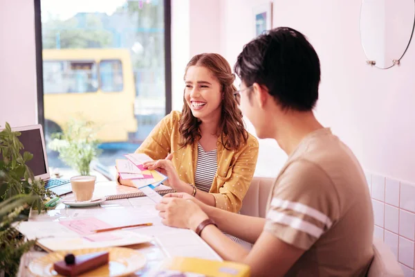 Young appealing student laughing spending her free time with boyfriend — Stock Photo, Image