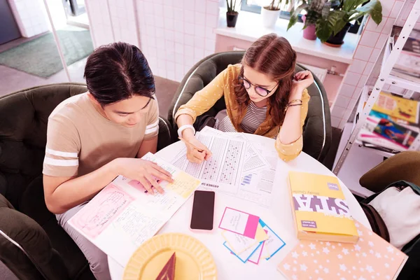 Young modern smart students working in little cozy cafe — Stock Photo, Image