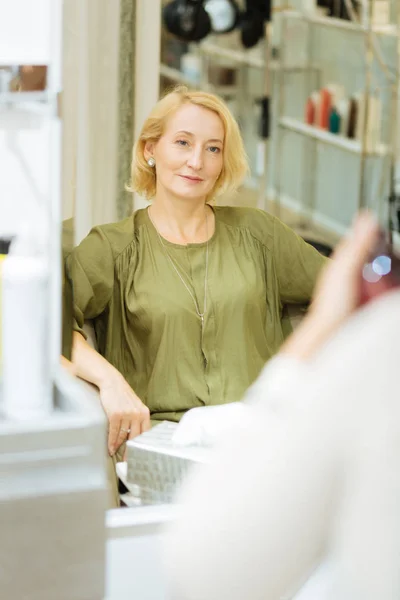 Delighted joyful woman looking at her reflection — Stock Photo, Image