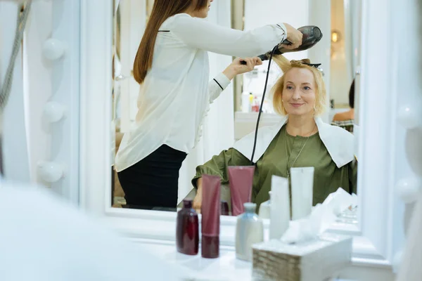 Positive nice woman having a new hairstyle done — Stock Photo, Image