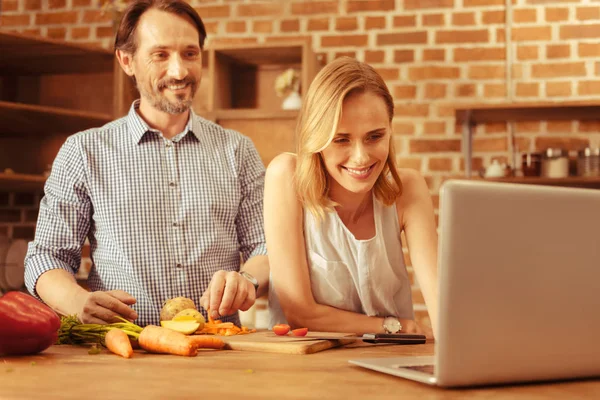 Positive delighted couple watching video — Stock Photo, Image
