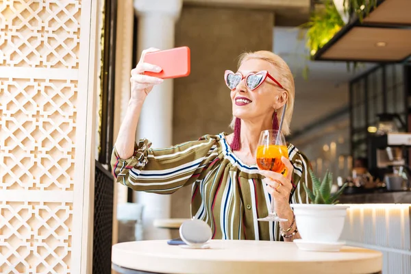 Cheerful nice woman taking selfie — Stock Photo, Image