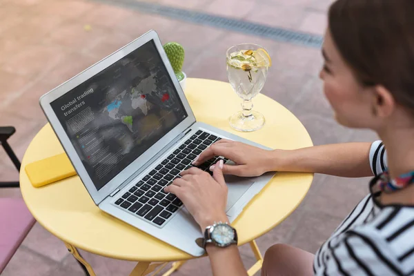 Modern remote worker working and drinking water with lemon