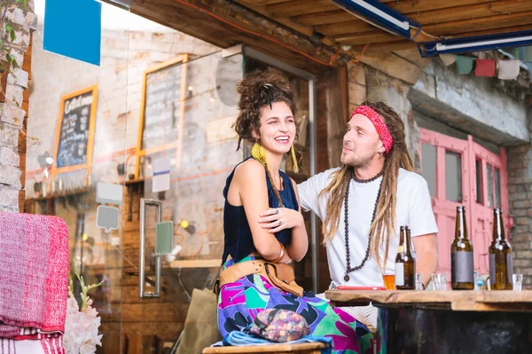 Hippie man with long hair looking at his lovely girlfriend — Stock Photo, Image