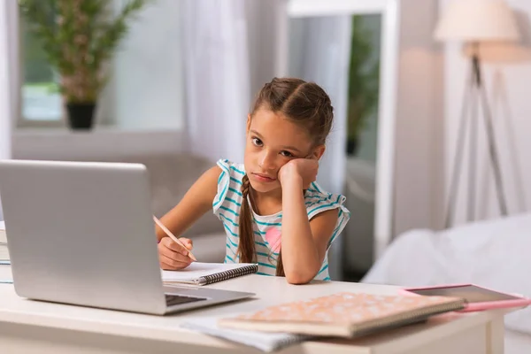 Cheerless unhappy little girl looking at you — Stock Photo, Image