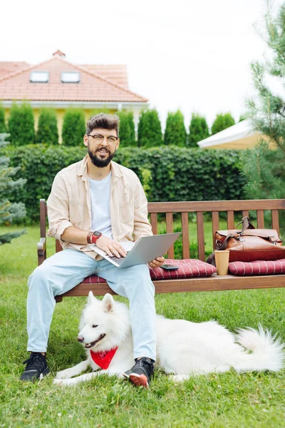 Stylish remote worker reading business letters sitting outside