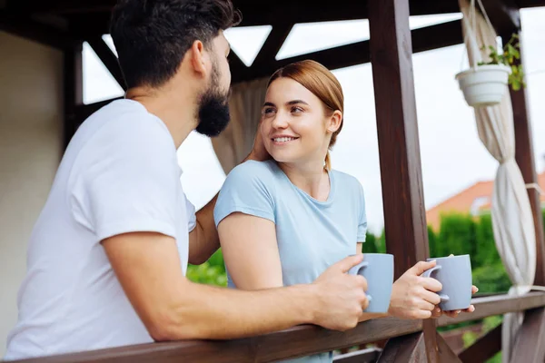 Smiling blonde-haired wife looking at her caring man — Stock Photo, Image