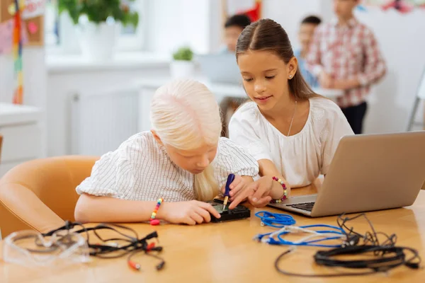 Nice kids dealing with the new invention — Stock Photo, Image