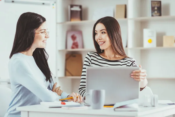 Positive young students looking at each other — Stock Photo, Image