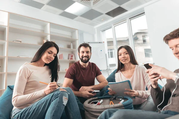 Nice young people sitting in the circle — Stock Photo, Image