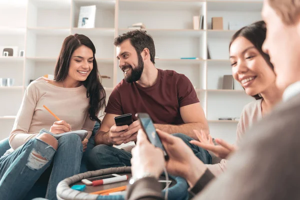 Nice young man smiling to his friend — Stock Photo, Image