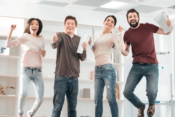 Delighted happy people jumping — Stock Photo, Image