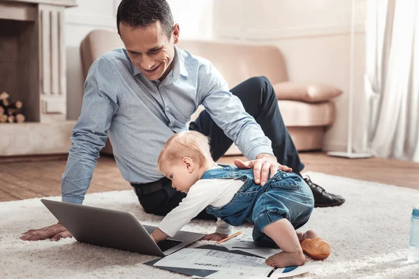 Cute happy baby playing with a laptop — Stock Photo, Image