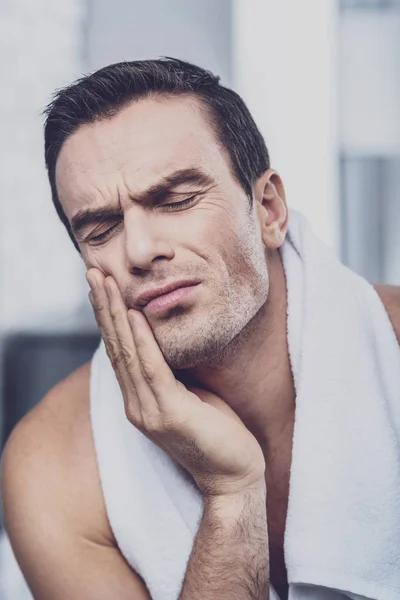 Exhausted man feeling the pain in his tooth — Stock Photo, Image